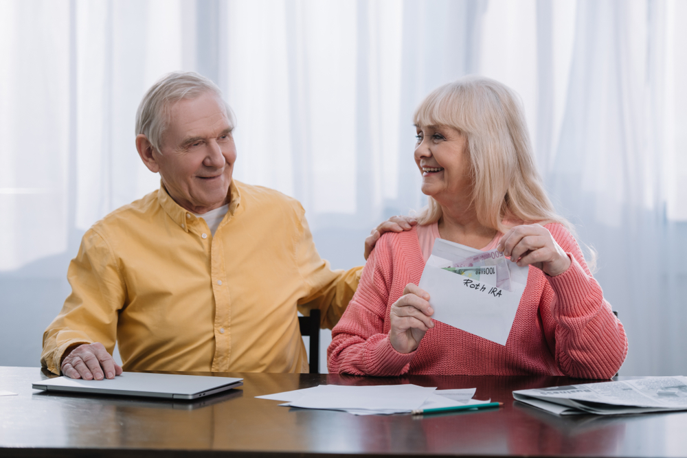 Seniors reviewing Roth IRA retirement income options - McLane Advisors, Montgomery & Tomball, TX